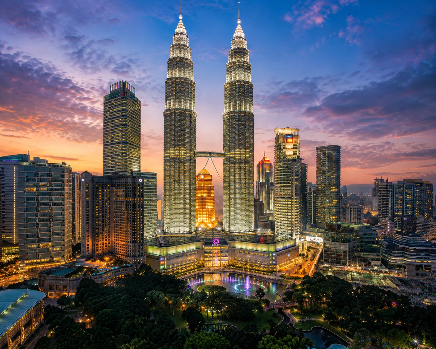KLCC at dusk with glowing fountains Kuala Lumpur
