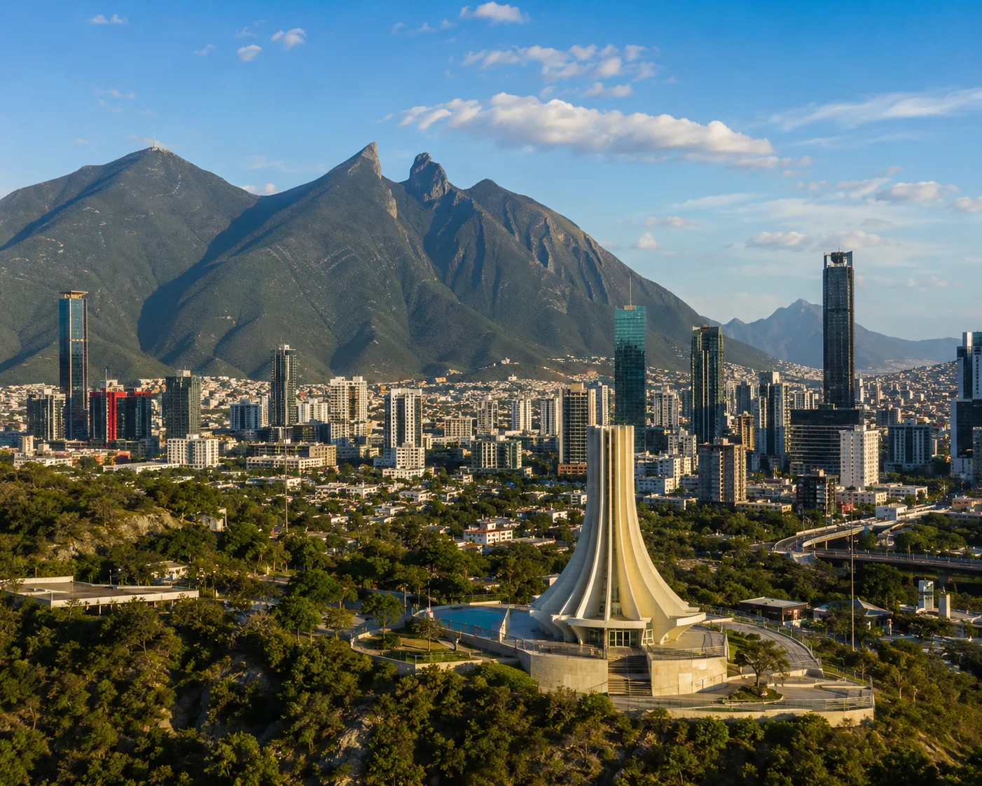 Modern monument with city and mountains Monterrey
